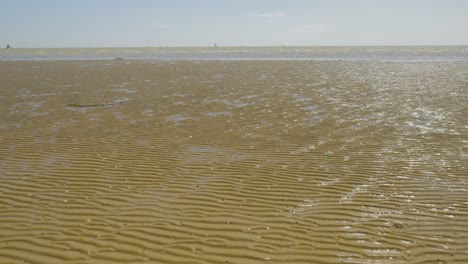 Forward-zooming-in-on-beach-sandwaves-during-low-tide