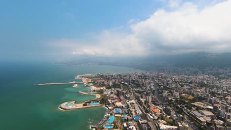 Aerial-Panorama-of-Sunny-Jounieh,-Lebanon:-Coastal-View-with-Harbor-and-Mountains