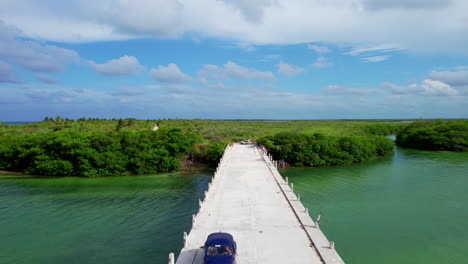 aerial-view-of-wooden-path-bridge-connecting-the-Sian-Kaʼan-Reserve-Tulum-Mexico-Quintana-Roo,-tourist-visiting-Caribbean-Sea-attraction
