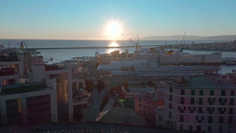 Sunset-aerial-pullback-over-bridge-of-Carignano-with-view-of-Genoa-port,-Italy