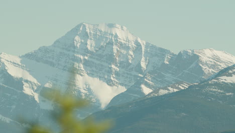 Snow-Capped-Mount-Robson,-Mountainous-Landscape,-Golden-Hour-CU