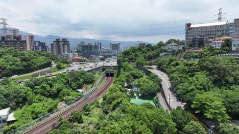 Drone-cityscape-of-Guandu-district-in-Taipei-City,-Taiwan