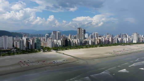 Establishing-Aerial-view-of-the-coastline-of-Santos-city,-sunny-day-in-Brazil