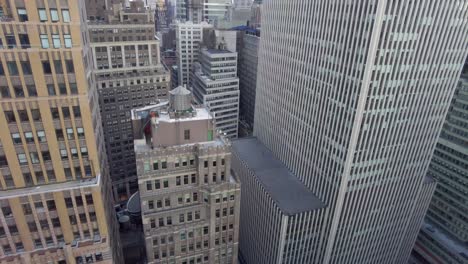 Aerial-birds-eye-overhead-top-down-view-of-tall-office-of-apartment-buildings