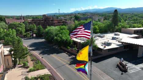 American,-New-Mexico,-and-pride-flags-waving-in-downtown-Santa-Fe,-NM
