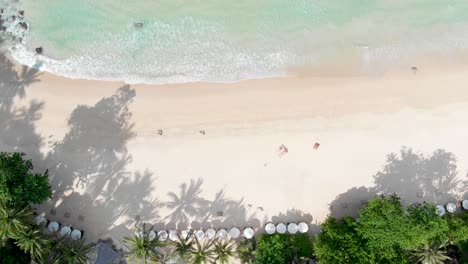 Phuket-Pansea-elevated-view,-from-sandy-beach-to-Andaman-Sea-calm-waves,-Thailand,-Southeast-Asia,-4K-Droneshot