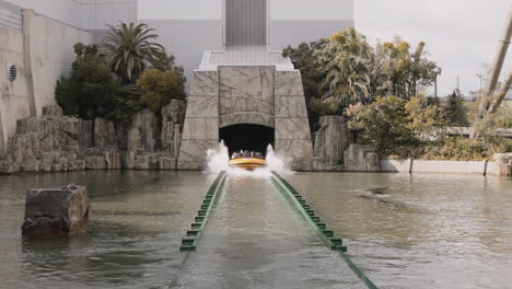 Visitors-on-Jurassic-Park:-The-Ride,-a-water-based-amusement-ride-at-Universal-Studios-Japan-in-Osaka