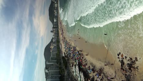Copacabana-Holiday-Maker-Beach-in-Rio,-de-Janeiro,-Breathtaking-Vertical-Aerial-View