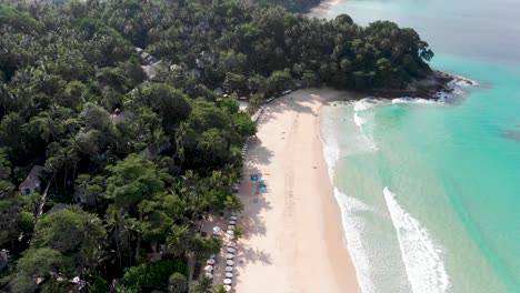 Phuket-Pansea-Pan-Up,-sandy-beach-and-Andaman-Sea-calm-waves,-empty-beach,-in-Thailand,-Southeast-Asia,-4K-Droneshot
