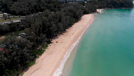 Empty-Beach-Nai-Thon,-Phuket,-along-the-coast-of-Andaman-Sea-in-Thailand,-4K-Drone-shot