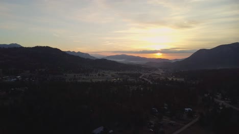 Aerial-sunrise-view-over-Estes-Park-valley,-Colorado