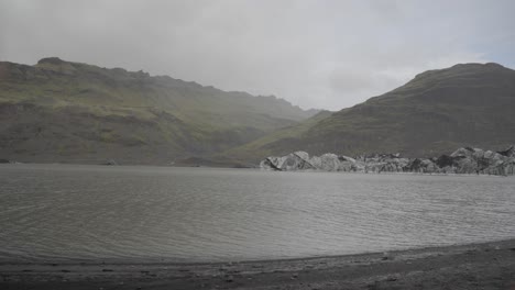 Misty-Icelandic-lake-with-rugged-mountains-evoking-loneliness