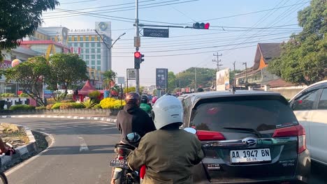 Fist-person-view-of-indonesia-traffic-jam-on-the-street-when-traffic-light-on-red