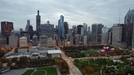 Aerial-view-around-the-illuminated-skyline-from-Grant-park,-fall-evening-in-Chicago