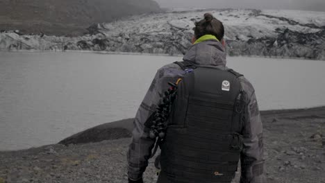 Caucasian-male-backpacker-enjoying-the-great-outdoors,-hike-around-a-glacier-lake