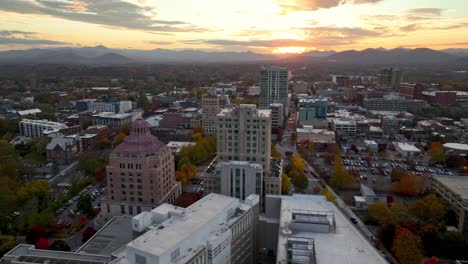 aerial-orbit-of-asheville-nc,-north-carolina-at-sunset-in-fall-and-autumn