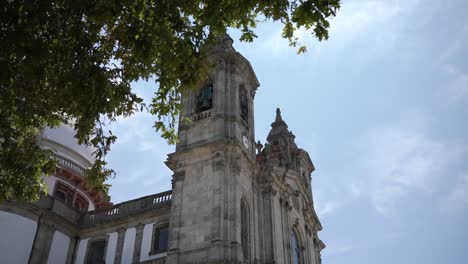 View-of-Sameiro-Sanctuary-tower,-ornate-architecture,-under-a-blue-sky