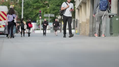 Capturing-the-streets-of-central-Nottingham,-England,-with-a-slow-motion-view-of-people-walking-at-street-level