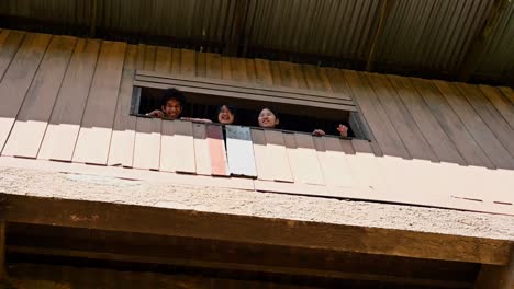 Enjoying-the-time-watching-wildlife-from-inside-the-tower,-one-looks-out-and-talks-to-his-friend,-Khao-Yai-National-Park,-Thailand