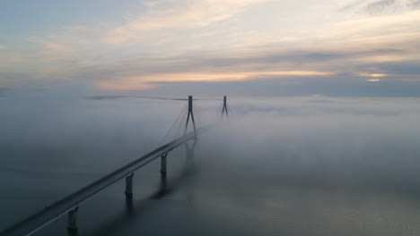 Epic-cinematic-shot-of-beautiful-bridge-above-cold-still-water-in-amazing-landscape-in-Northern-Finland,-Europe-architectural