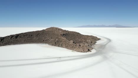 Salar-de-Uyuni-base-camp-at-the-Andes-mountains-in-Bolivia,-aerial-orbital