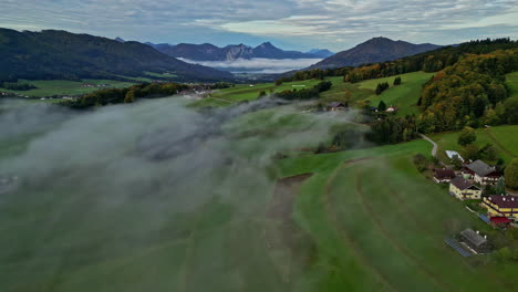 Misty-Morning-Over-Rural-Scene-With-Villages-And-Green-Mountains