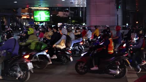 City-Street-View-Of-Motorbikes-Crossing-Busy-Intersection-In-Bangkok-Thailand