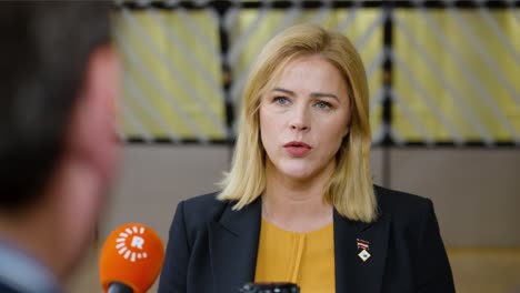 Latvian-Prime-Minister-Evika-Siliņa-talking-to-the-press-at-the-European-Council-summit-in-Brussels,-Belgium---Close-shot