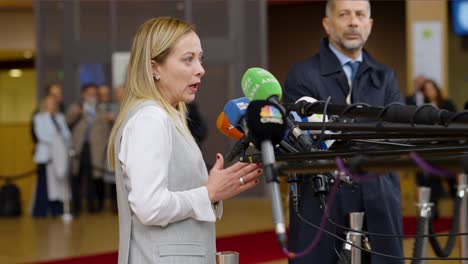 Italian-Prime-Minister-Giorgia-Meloni-talking-to-the-press-at-the-European-Council-summit-in-Brussels,-Belgium---Profile-shot