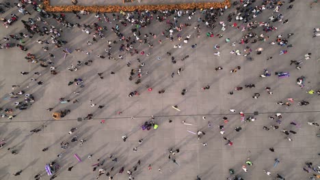Drone-video,-people-watching-the-Day-of-the-Dead-offering-in-Mexico-City's-historic-center