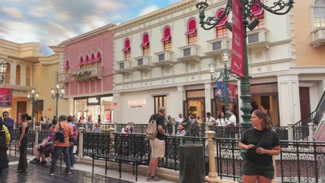 Inside-Venetian-hotel-and-casino-with-fake-sky-and-replica-of-Italian-street-and-people