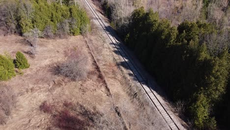 Aerial-Flyover-Of-A-Train-Railway-Line-In-Caledon,-Ontario