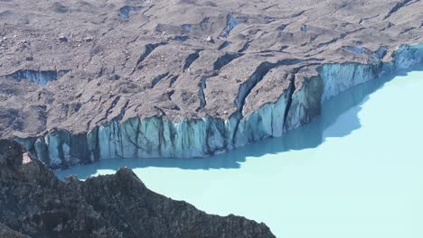 Aerial-close-up-Tasman-Glacier-and-Lake-in-Aoraki-National-Park,-New-Zealand