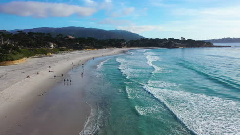 Aerial-view-rising-over-the-Carmel-Sunset-Beach,-in-sunny-Monterey,-California,-USA
