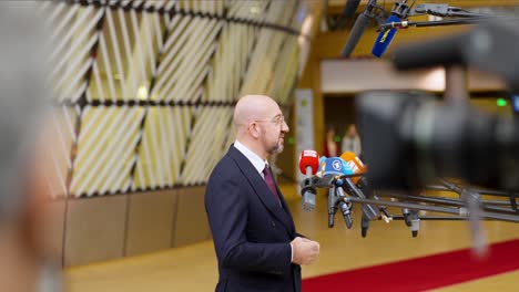 President-of-the-European-Council-Charles-Michel-talking-to-the-press-at-the-European-Council-summit-in-Brussels,-Belgium---Profile-shot,-slow-motion
