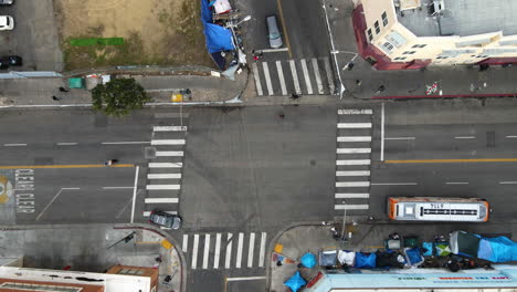 Aerial-birds-eye-shot-over-homeless-tents-on-the-streets-of-Skid-Row,-Los-Angeles