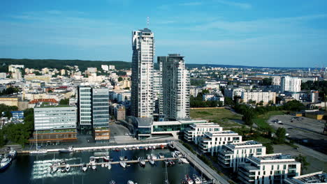 Aerial-view-of-Sea-Towers,-Gdynia,-with-marina-and-cityscape