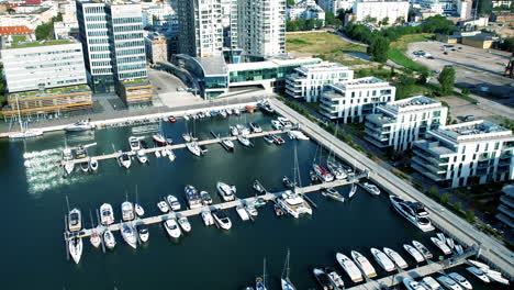 Aerial-view-of-luxury-boats-and-ships-parking-at-marina-of-Gdynia-in-Poland---Noble-apartment-blocks-with-sea-view