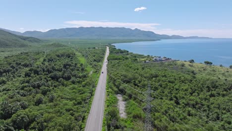 Aerial-birds-eye-shot-of-CARRETERA-SANCHEZ-road-in-exotic-landscape-during-sunny-day,-Dominican-Republic