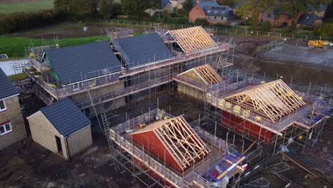 Aerial-view-houses-under-construction-with-wood-timber-roof-structure