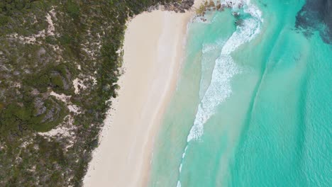 Drone-swirling-around-waves-at-pristine-white-sand-beach-in-Margaret-River,-Western-Australia