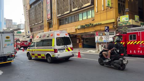 View-of-an-ambulance-moved-away-from-the-traffic-in-Taipei-Wanhua-district,-Ximending,-Taiwan