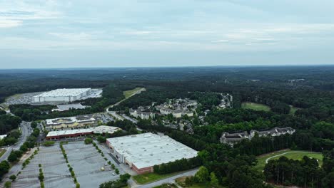Aerial-view-of-storage-facility-buildings-near-Stone-Mountain-in-Georgia,-America---Wide-shot