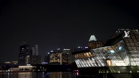 Iconic-Illuminated-Louis-Vuitton-Store-On-The-Waterfront-At-Marina-Bay-In-Singapore-At-Night