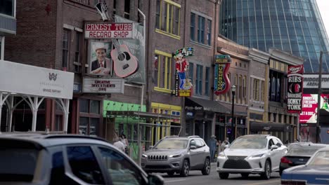 Cars-driving-along-Broadway-Street-in-Nashville,-Tennessee-in-slow-motion