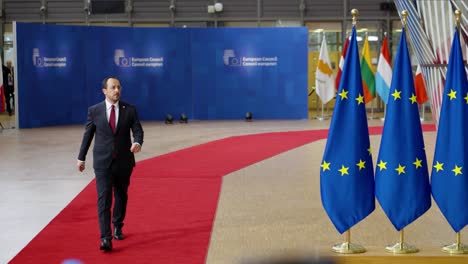 Cyprus'-President-Nikos-Christodoulides-arriving-on-the-red-carpet-at-the-European-Council-summit-in-Brussels,-Belgium---Slow-motion