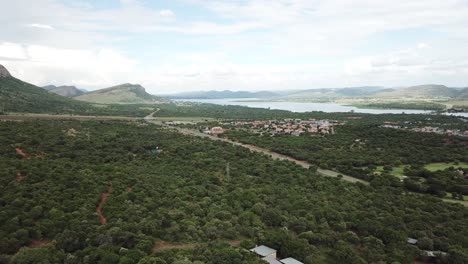 Drone-shot-of-the-Hartbeespoort-region-with-the-Hartebeespoort-Dam-in-the-distance,-North-West-Province,-South-africa