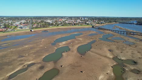 Over-mud-and-pools-of-water-in-Lake-Mulwala-after-the-lake-was-drained-for-weed-eradication