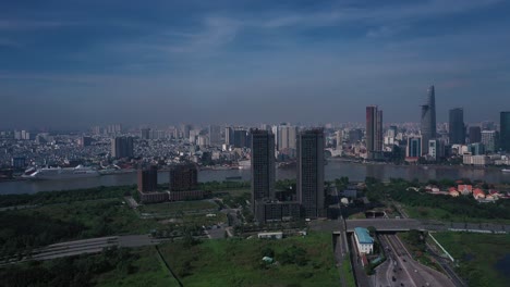 Aerial-panorama-Vietnam,-Ho-Chi-Minh-City-Skyline-panorama-on-sunny-clear-day-featuring-architecture,-Saigon-River-and-Cruise-Ship