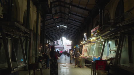 Bustling-indoor-market-with-vendors-and-shoppers-on-market-in-Athens,-Greece